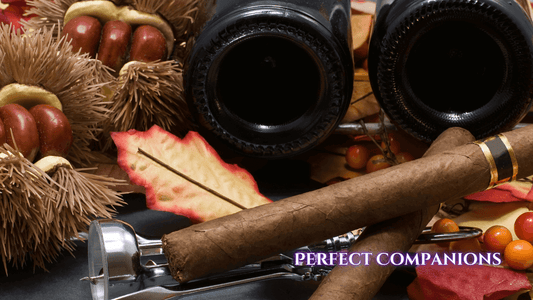 A cigar and 2 bottles of wine on a table