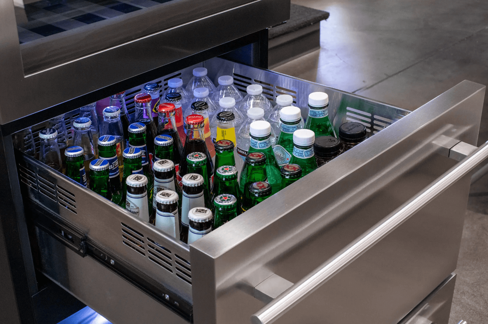 Allavino 108 Bottle Black or Stainless Wine Refrigerator with Two Refrigerated Drawers image of beverage drawer filled with bottles and cans