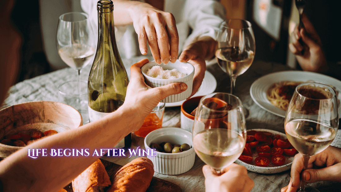 People eating and drinking wine