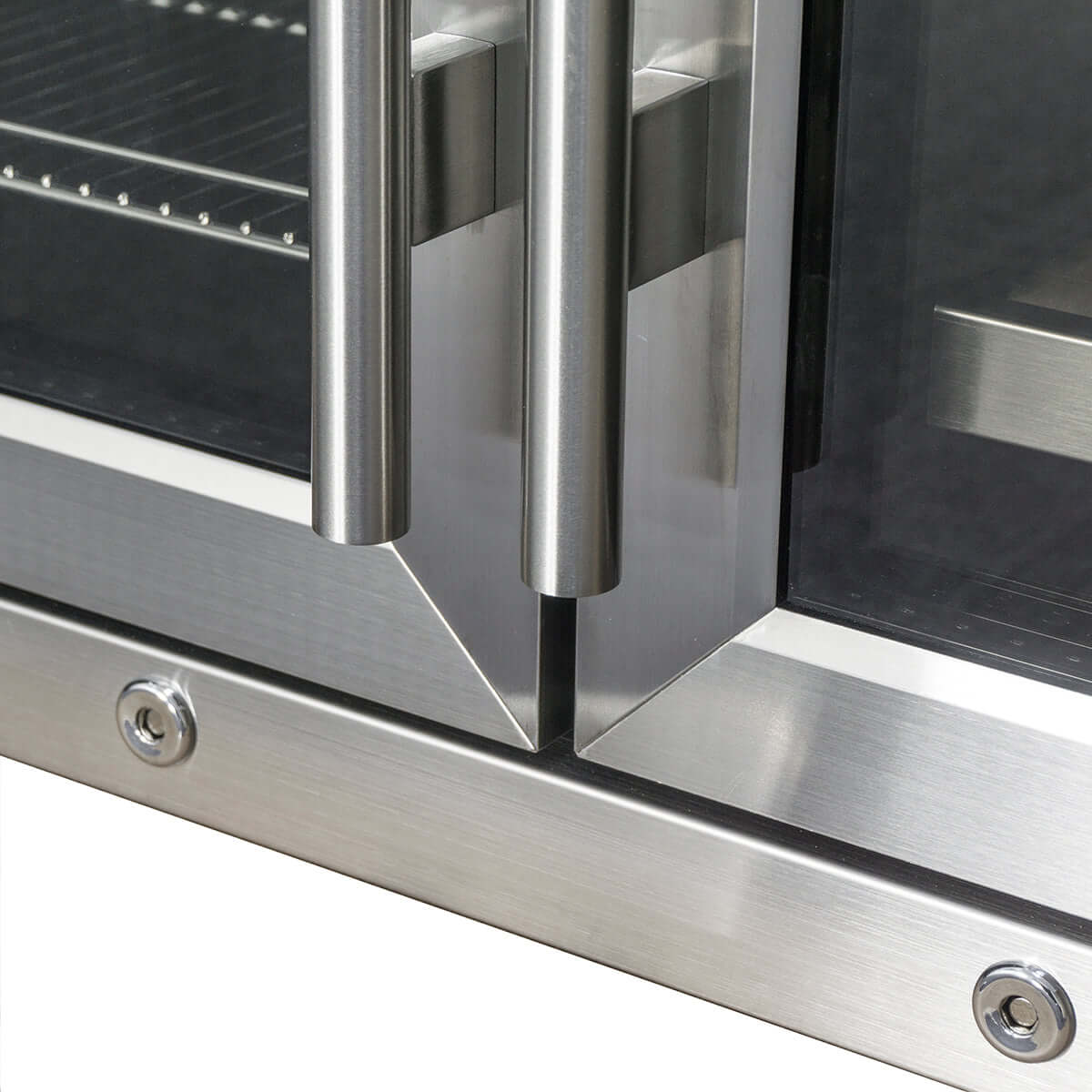 Close-up of the polished stainless steel handles and edges of the KBU28LRX under-counter wine and beer fridge combo.